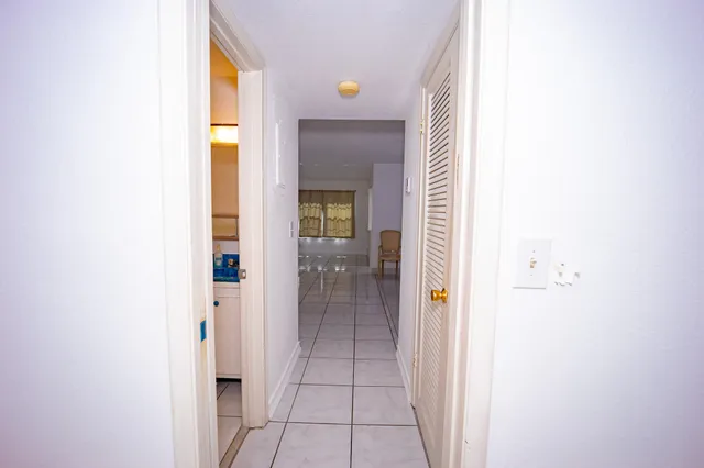 a view of a hallway with a dining room