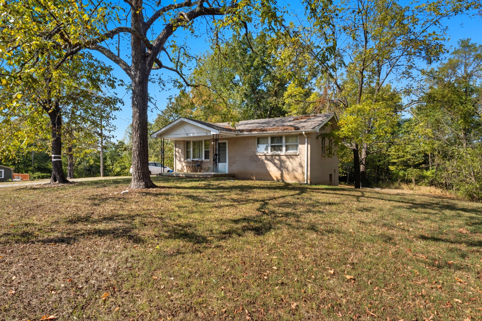 833 Grays Chapel Road Southside, TN 37171 - Photo 2 of 23 a front view of a house with a yard and trees