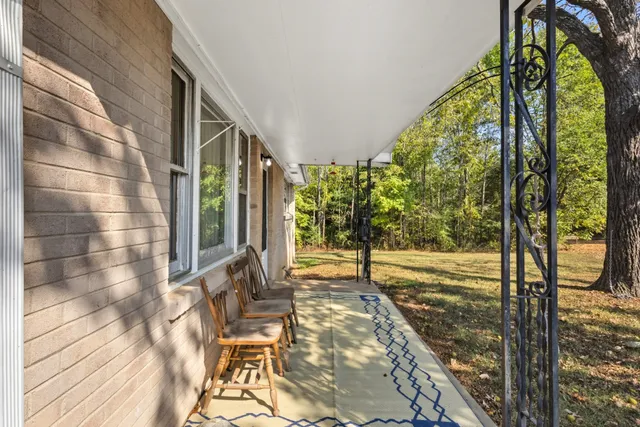 a view of a porch with a backyard
