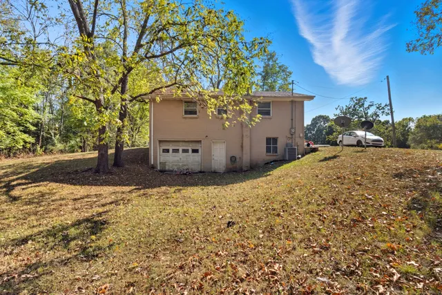 a view of a house with a tree