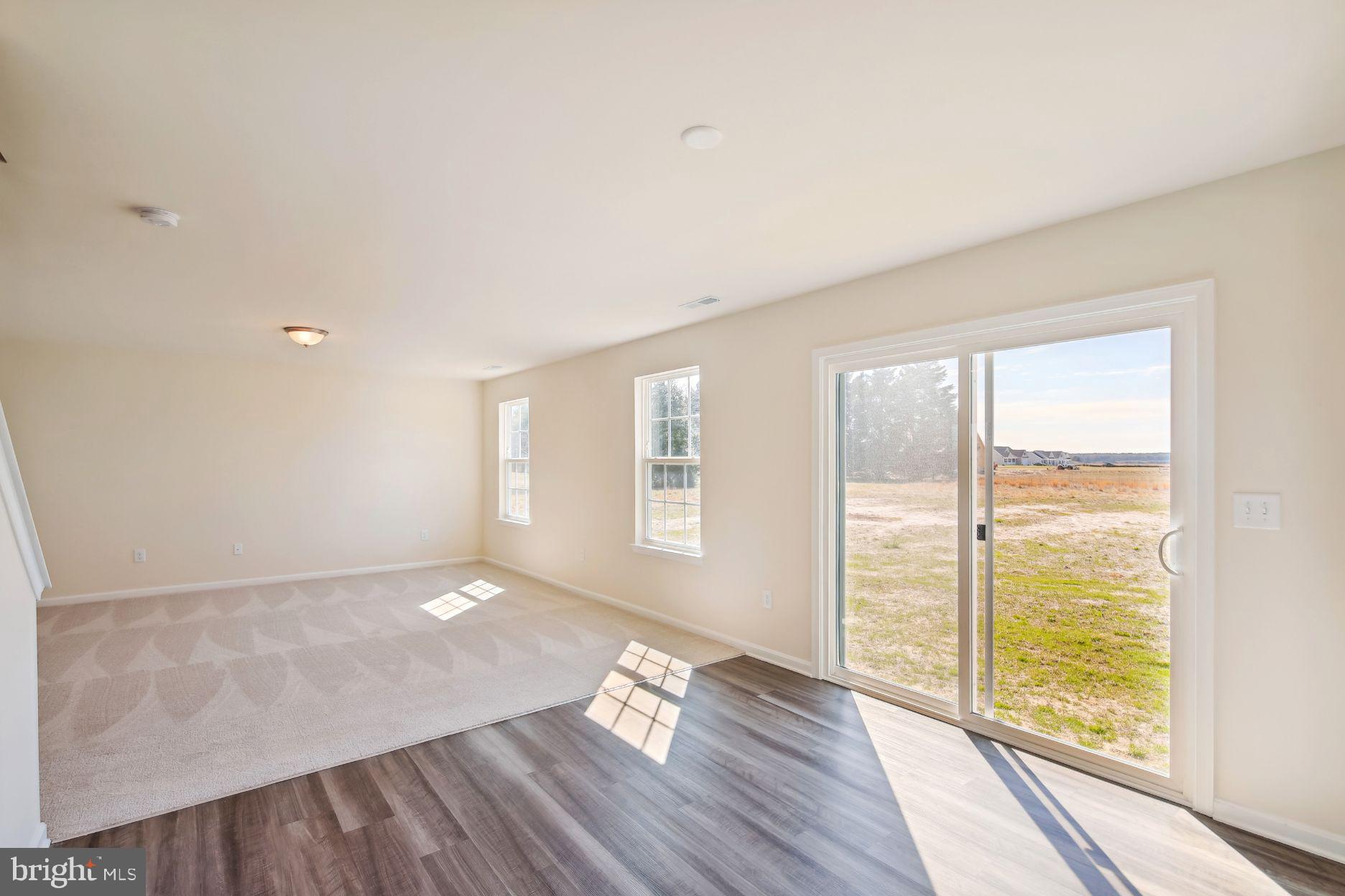 12156 Rousby Hall Road Lusby, MD 20657 - Photo 10 of 22 From kitchen looking into living room