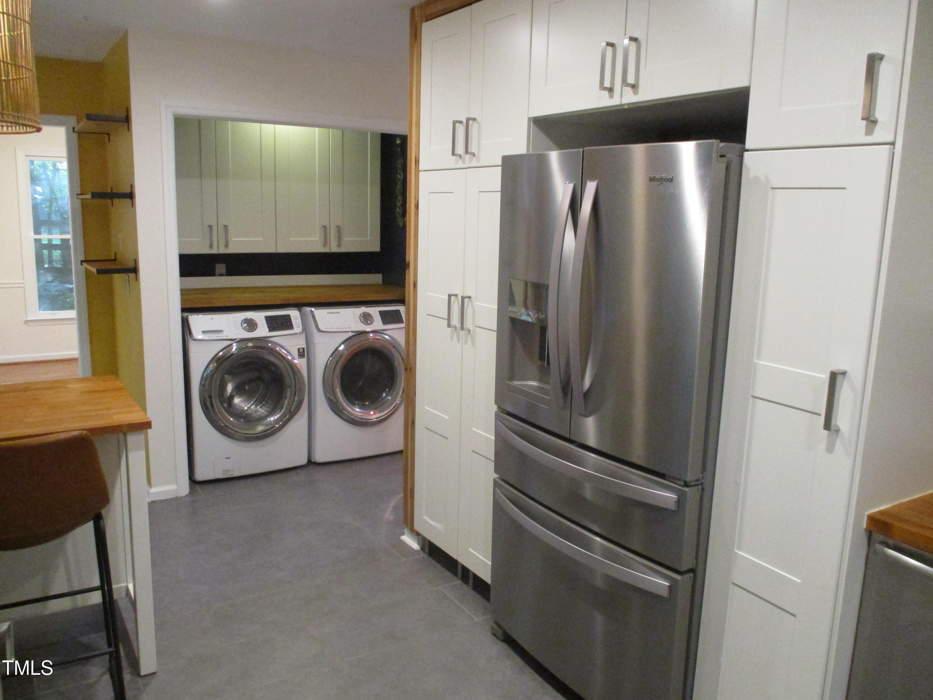 5315 Reams Run Road Durham, NC 27713 - Photo 12 of 49 a utility room with stainless steel appliances washer and dryer