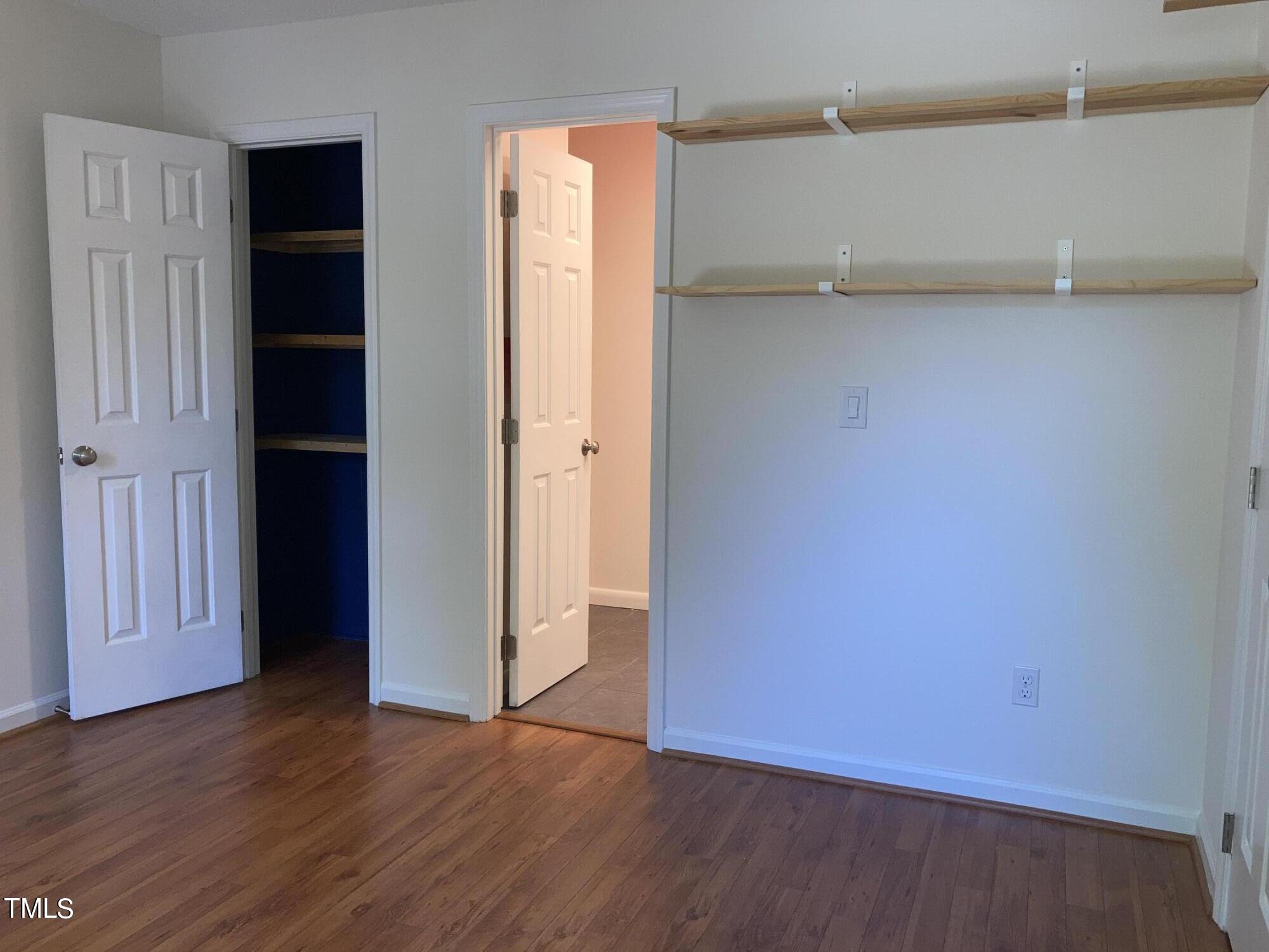 5315 Reams Run Road Durham, NC 27713 - Photo 17 of 49 an empty room with wooden floor and closet
