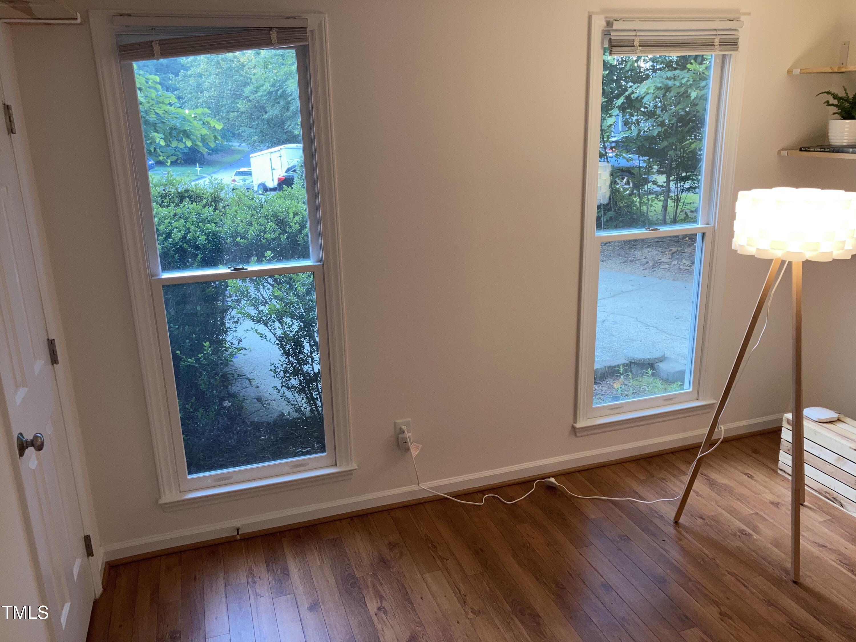 5315 Reams Run Road Durham, NC 27713 - Photo 19 of 49 a view of an empty room with wooden floor and a window