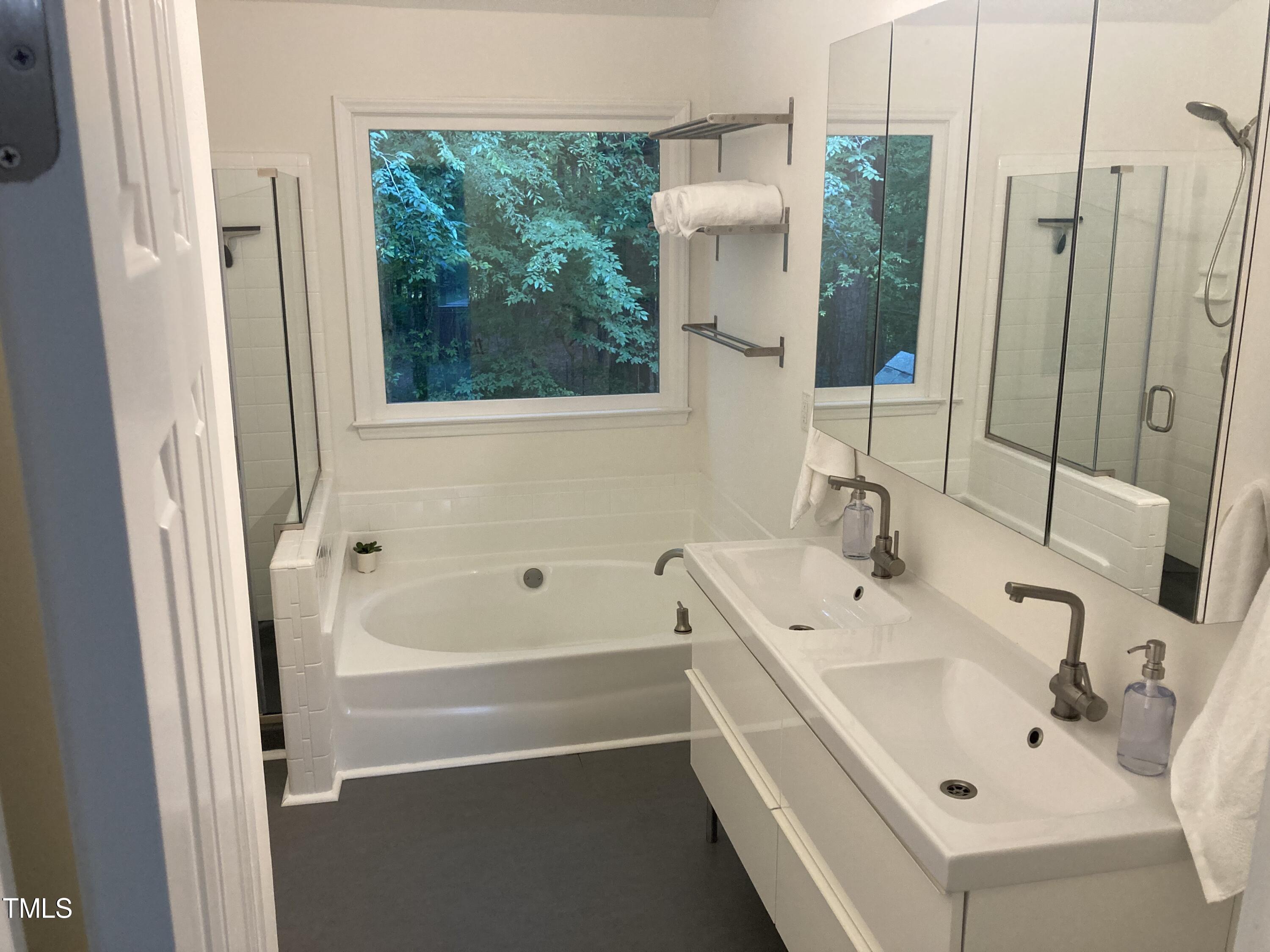 5315 Reams Run Road Durham, NC 27713 - Photo 37 of 49 a bathroom with a sink and a bathtub