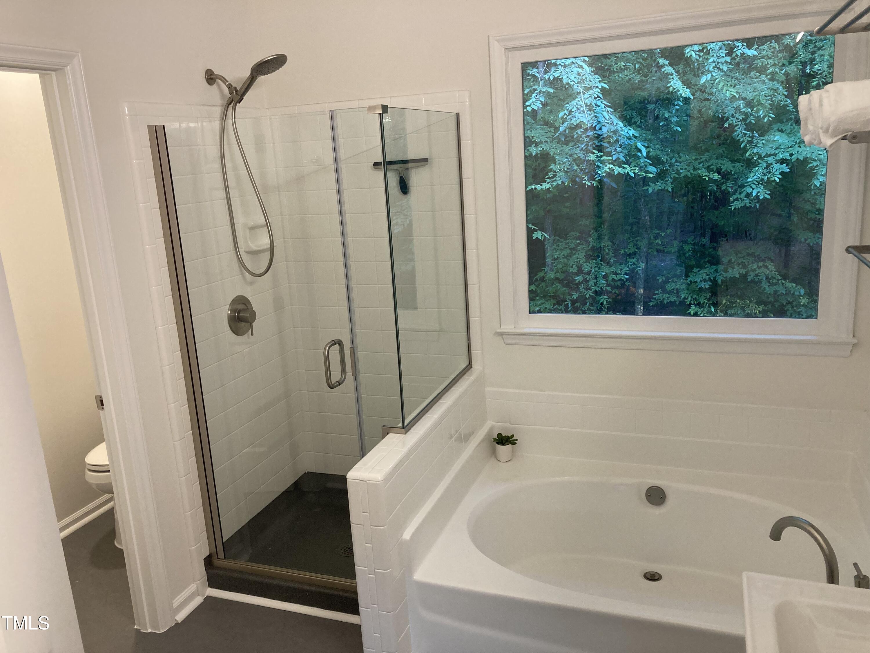 5315 Reams Run Road Durham, NC 27713 - Photo 38 of 49 a bathroom with a bathtub and shower