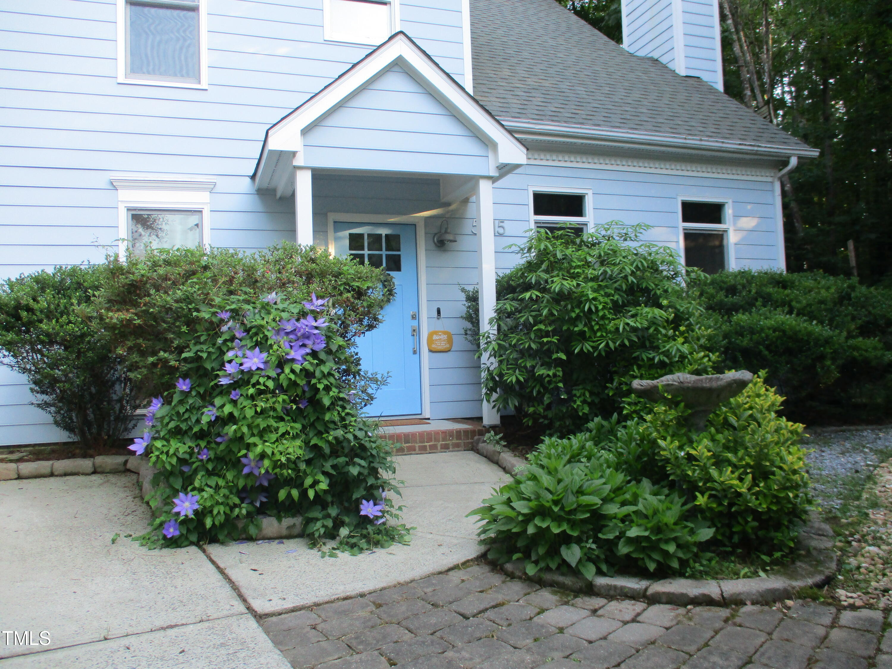 5315 Reams Run Road Durham, NC 27713 - Photo 4 of 49 a front view of a house with garden
