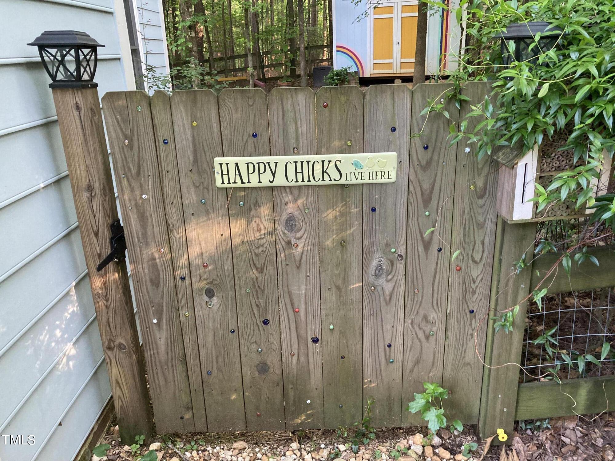 5315 Reams Run Road Durham, NC 27713 - Photo 42 of 49 a view of a wooden door with a tree
