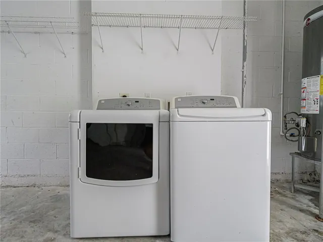 a front view of a house with a yard and a garage