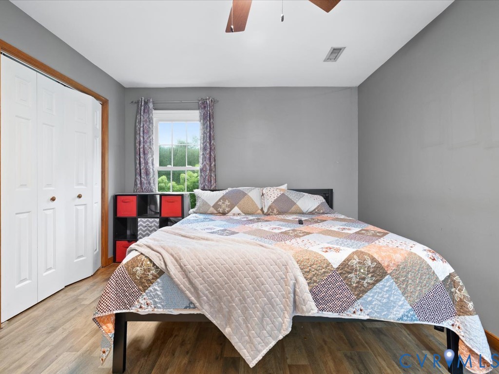 3695 Three Chopt Road Gum Spring, VA 23065 - Photo 27 of 55 Bedroom featuring wood-finish flooring, a double-d