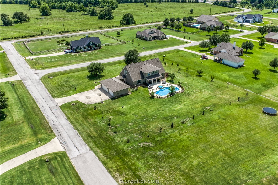 586 Ruby Drive Bellville, TX 77418 - Photo 46 of 50 a view of a golf course with the houses