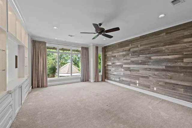 a view of kitchen with furniture and large windows