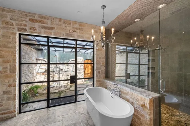 a bedroom with a balcony a bed and a couch