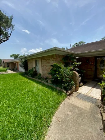 a front view of house with garden