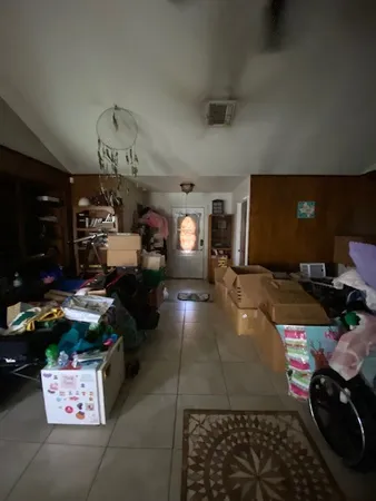 a room with lots of furniture and view kitchen