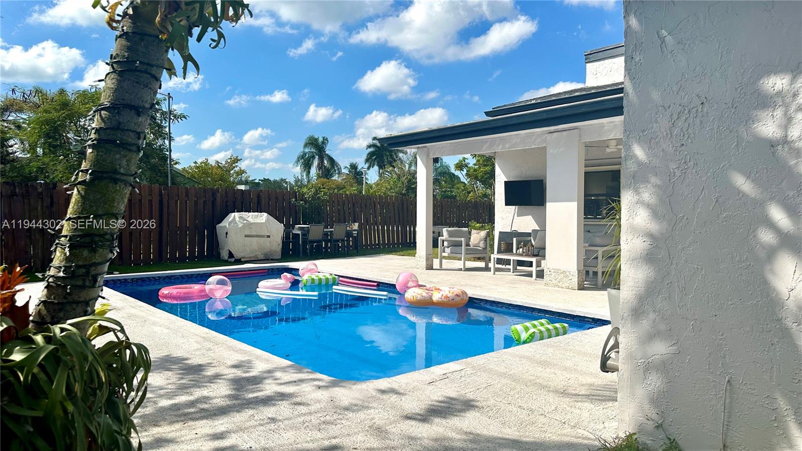 528 Southwest 166th Terrace Weston, FL 33326 - Photo 1 of 14 a view of a swimming pool with a patio