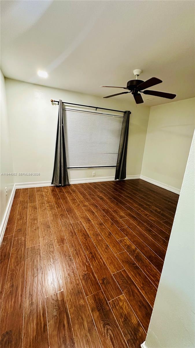 528 Southwest 166th Terrace Weston, FL 33326 - Photo 9 of 14 a view of a room with wooden floor and a carpet
