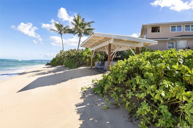 a view of a house with a yard and garden