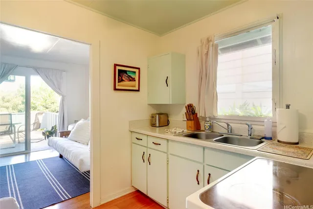 a bedroom with furniture and a window