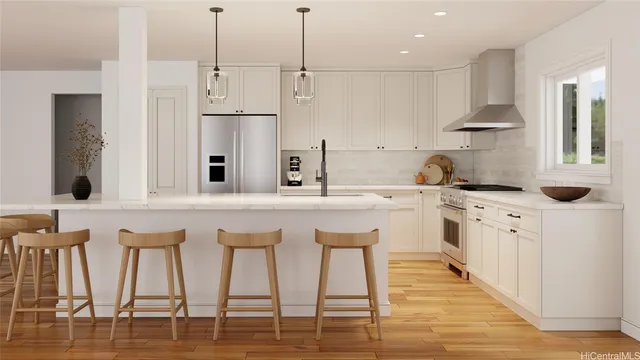 a kitchen with stainless steel appliances kitchen island granite countertop a table chairs sink and cabinets