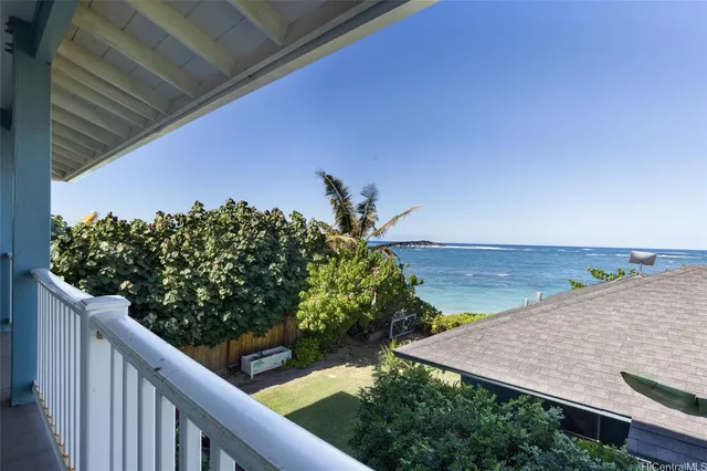 a view of a balcony with plants