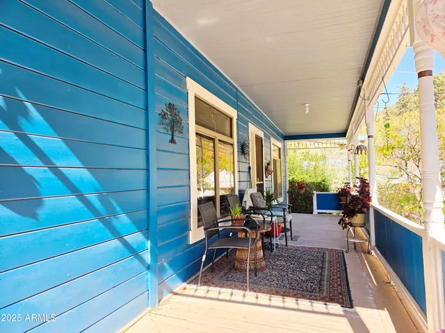 a view of a pathway of a house with wooden fence