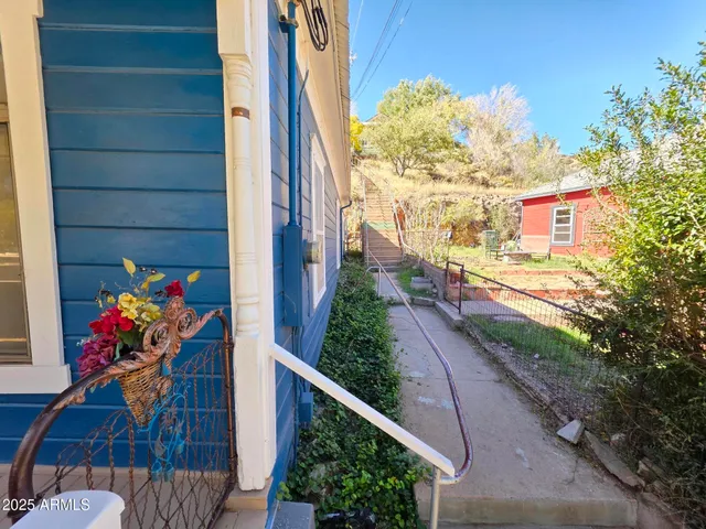 a view of backyard with wooden deck