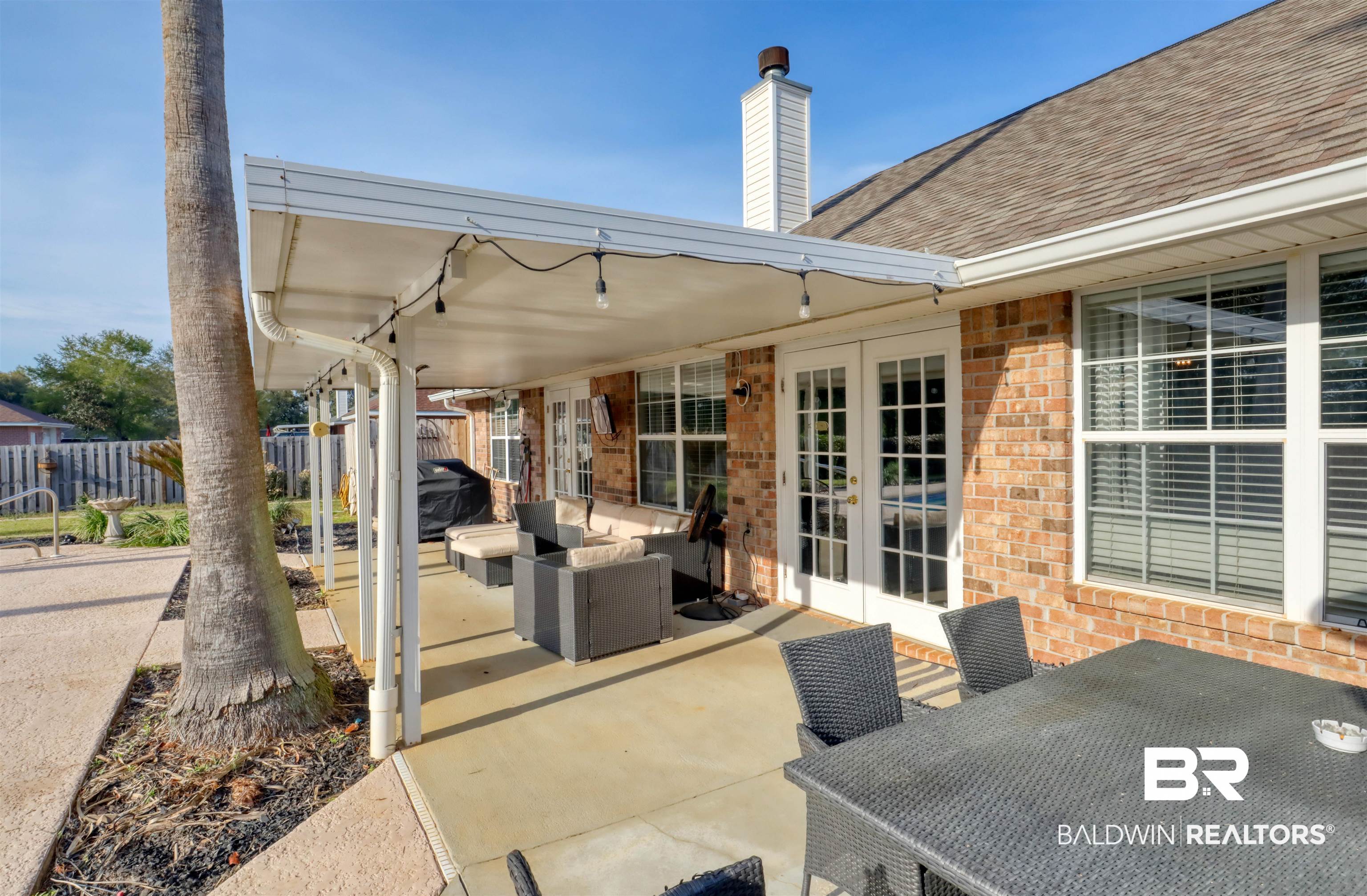 12893 Hunters Chase Foley, AL 36535 - Photo 41 of 42 View of patio with french doors, an outdoor living space, fence, and outdoor dining space