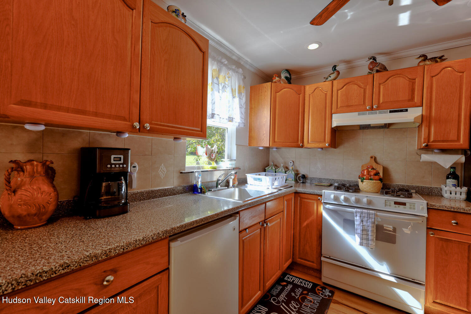 626 Bross Street Cairo, NY 12413 - Photo 22 of 78 a kitchen with stainless steel appliances wooden cabinets a sink and a stove