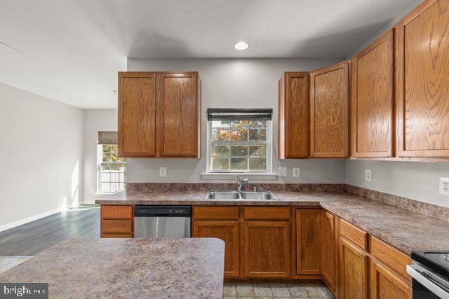 722 Cardiff Circle Edgewood, MD 21040 - Photo 11 of 38 a kitchen with wooden cabinets a sink and a window