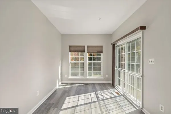 a view of empty room with windows