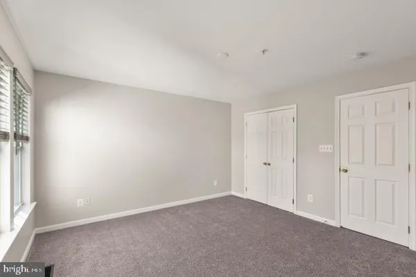 a view of an empty room and a window