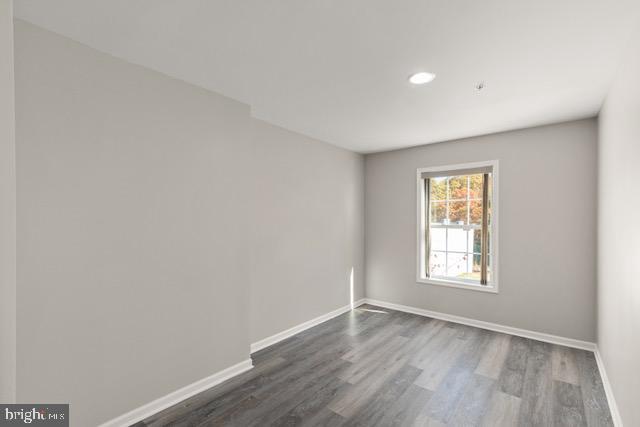 722 Cardiff Circle Edgewood, MD 21040 - Photo 31 of 38 an empty room with wooden floor and windows
