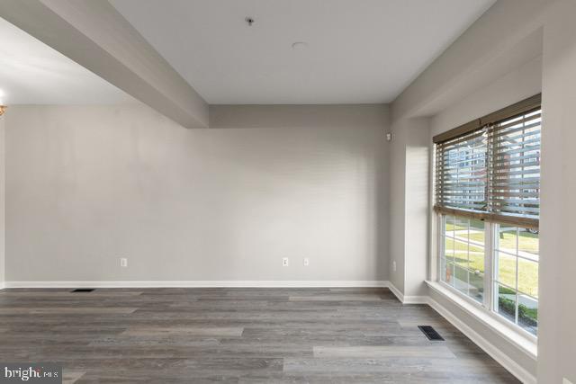 722 Cardiff Circle Edgewood, MD 21040 - Photo 4 of 38 a view of an empty room with wooden floor and a window