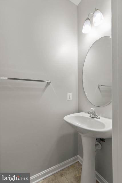 722 Cardiff Circle Edgewood, MD 21040 - Photo 6 of 38 a bathroom with a sink a mirror and vanity