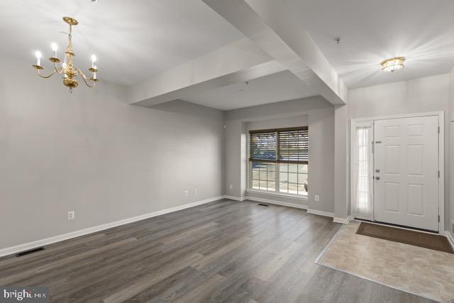 722 Cardiff Circle Edgewood, MD 21040 - Photo 9 of 38 a view of an empty room with wooden floor and a window