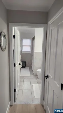 a kitchen with a dining table chairs sink and cabinets