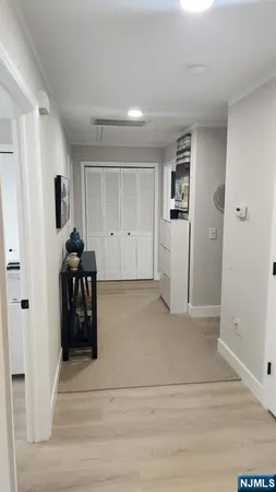 a large kitchen with a sink and a stove