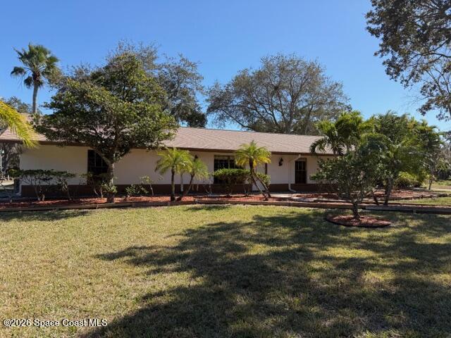 1201 Northeast Tropicana Road Palm Bay, FL 32905 - Photo 2 of 23 a view of a house with swimming pool and sitting area