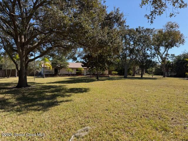 1201 Northeast Tropicana Road Palm Bay, FL 32905 - Photo 4 of 23 a view of pool with trees