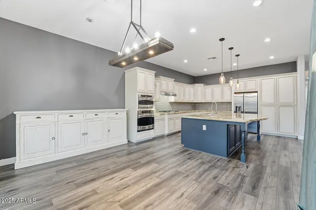 a kitchen with granite countertop counter space a sink appliances and cabinets