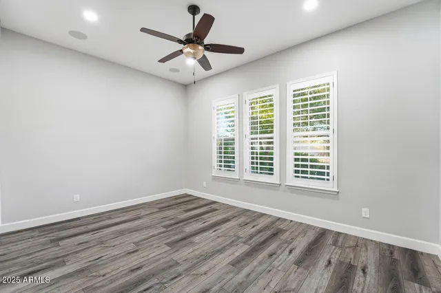 a bathroom with a sink a toilet and shower curtain