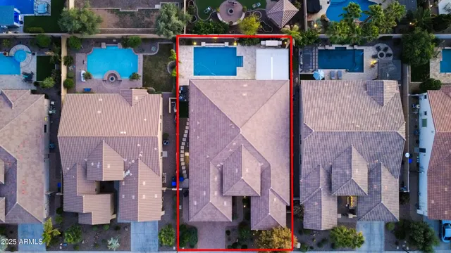 an aerial view of residential houses with outdoor space