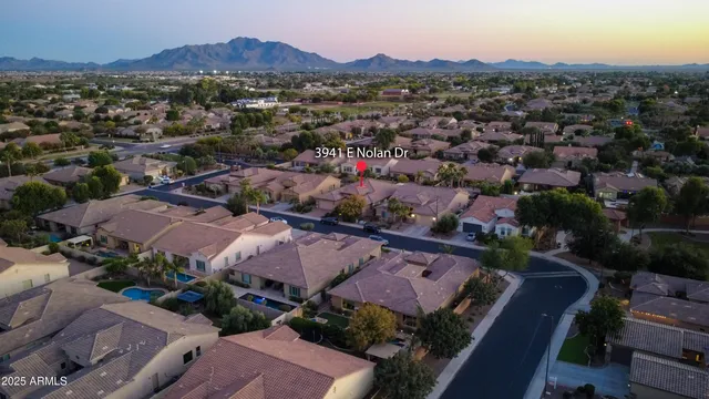 an aerial view of residential houses and outdoor space