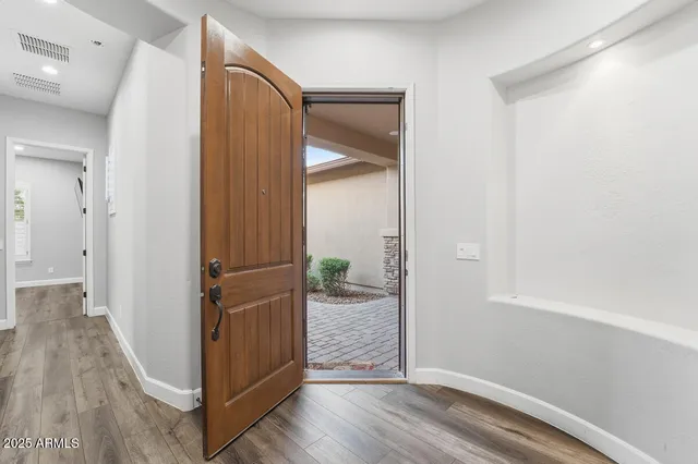 a view of entryway with wooden floor