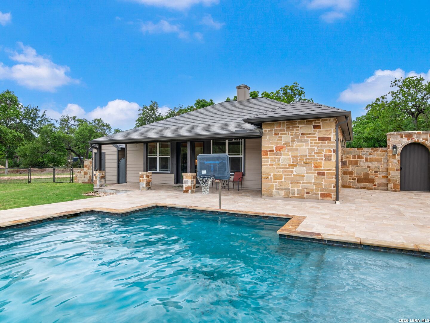 103 South Cibolo Hollow Fair Oaks Ranch, TX 78015 - Photo 43 of 79 a front view of a house with swimming pool having outdoor seating