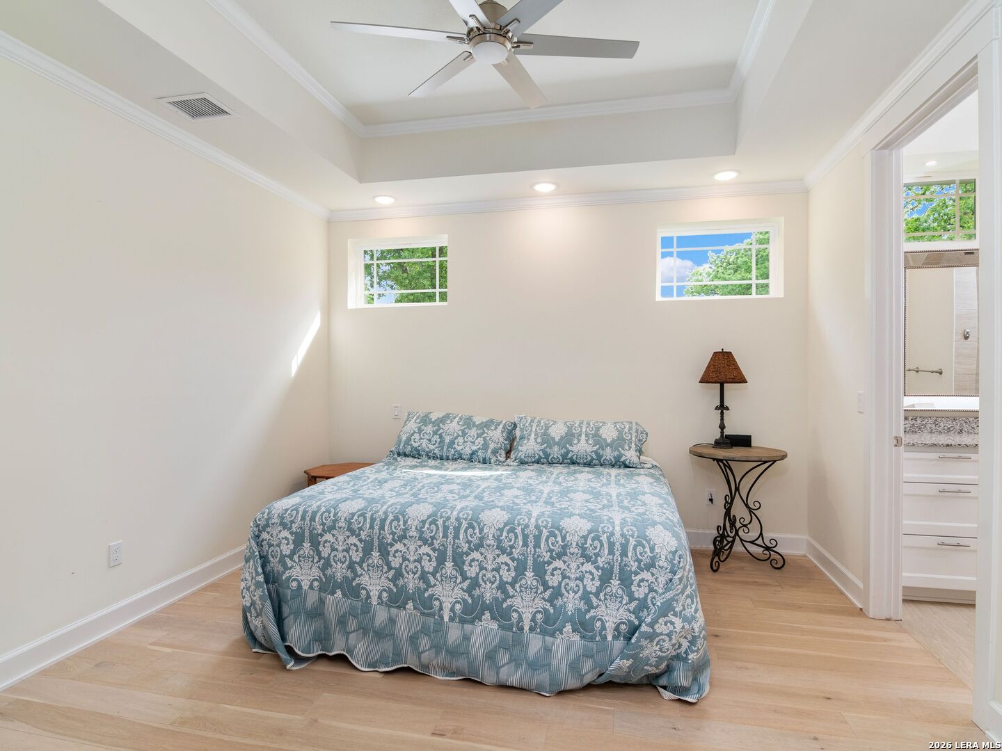103 South Cibolo Hollow Fair Oaks Ranch, TX 78015 - Photo 54 of 79 a bedroom with a bed and a chandelier