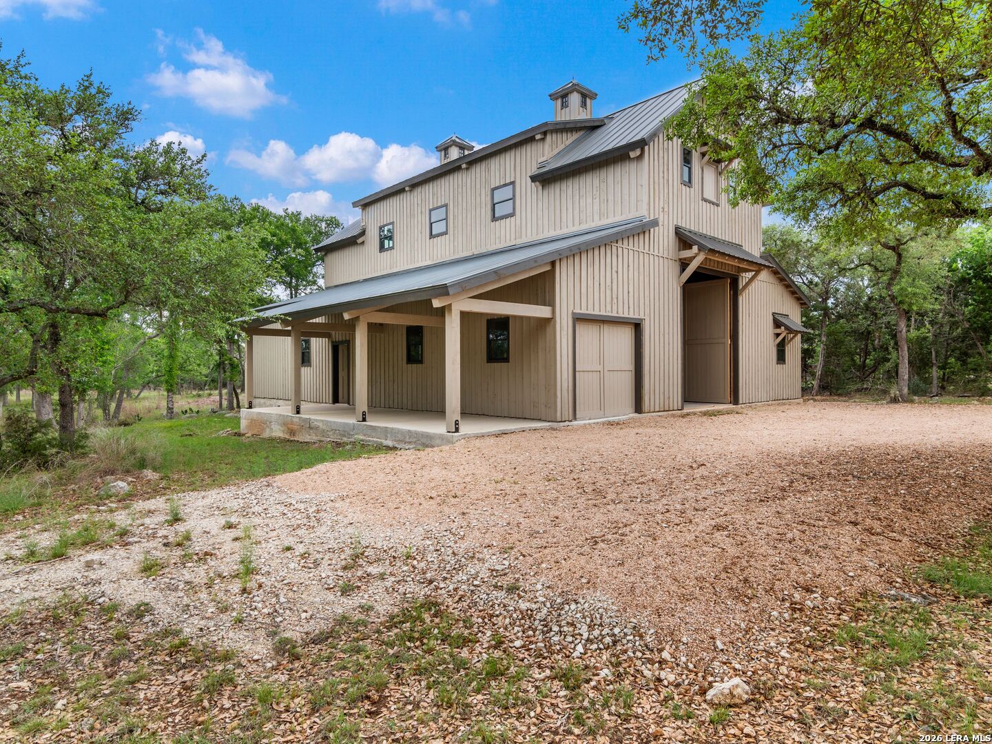 103 South Cibolo Hollow Fair Oaks Ranch, TX 78015 - Photo 60 of 79 a front view of a house with a yard