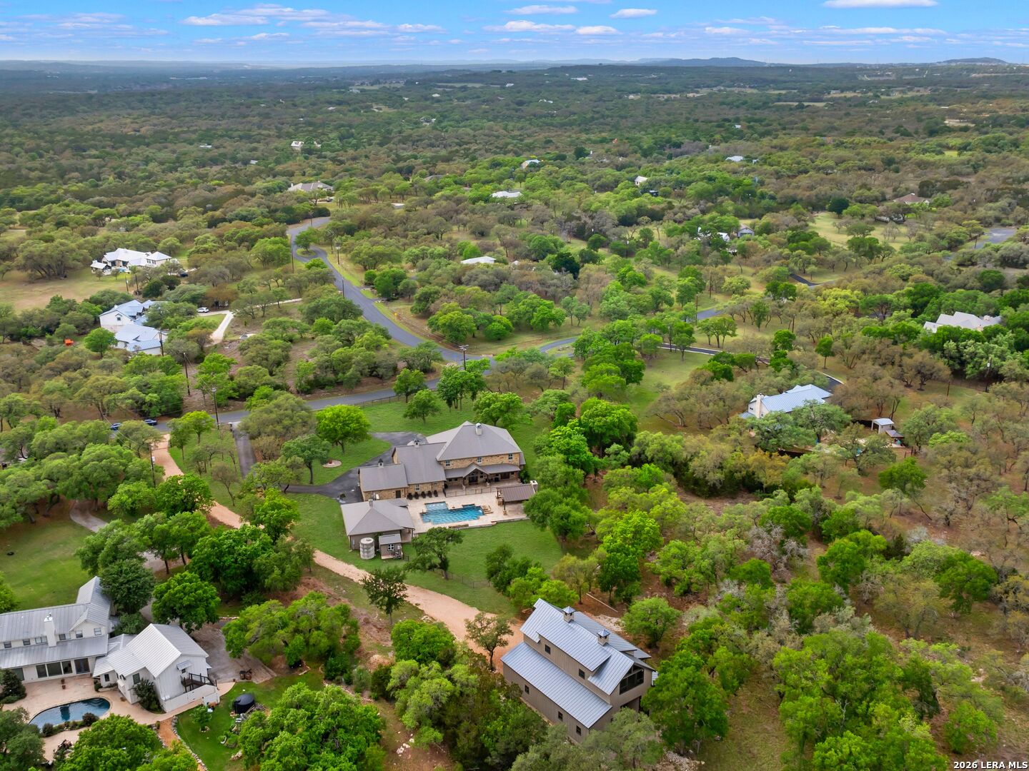 103 South Cibolo Hollow Fair Oaks Ranch, TX 78015 - Photo 72 of 79 an aerial view of residential houses with outdoor space and trees
