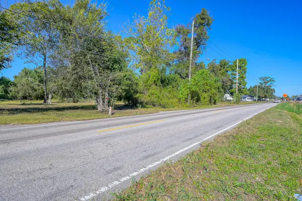 a view of a yard with a house